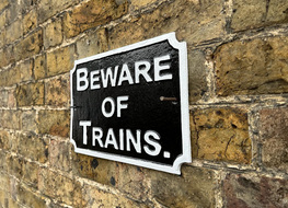 bewae of trains sign